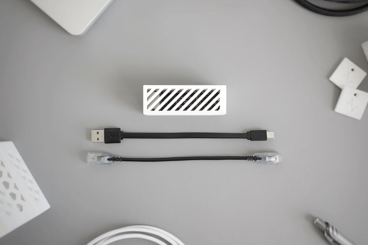What's in the box: the Solar Monitor in its vented white enclosure, a USB-A to USB-C power cable, and a short Ethernet patch cable.