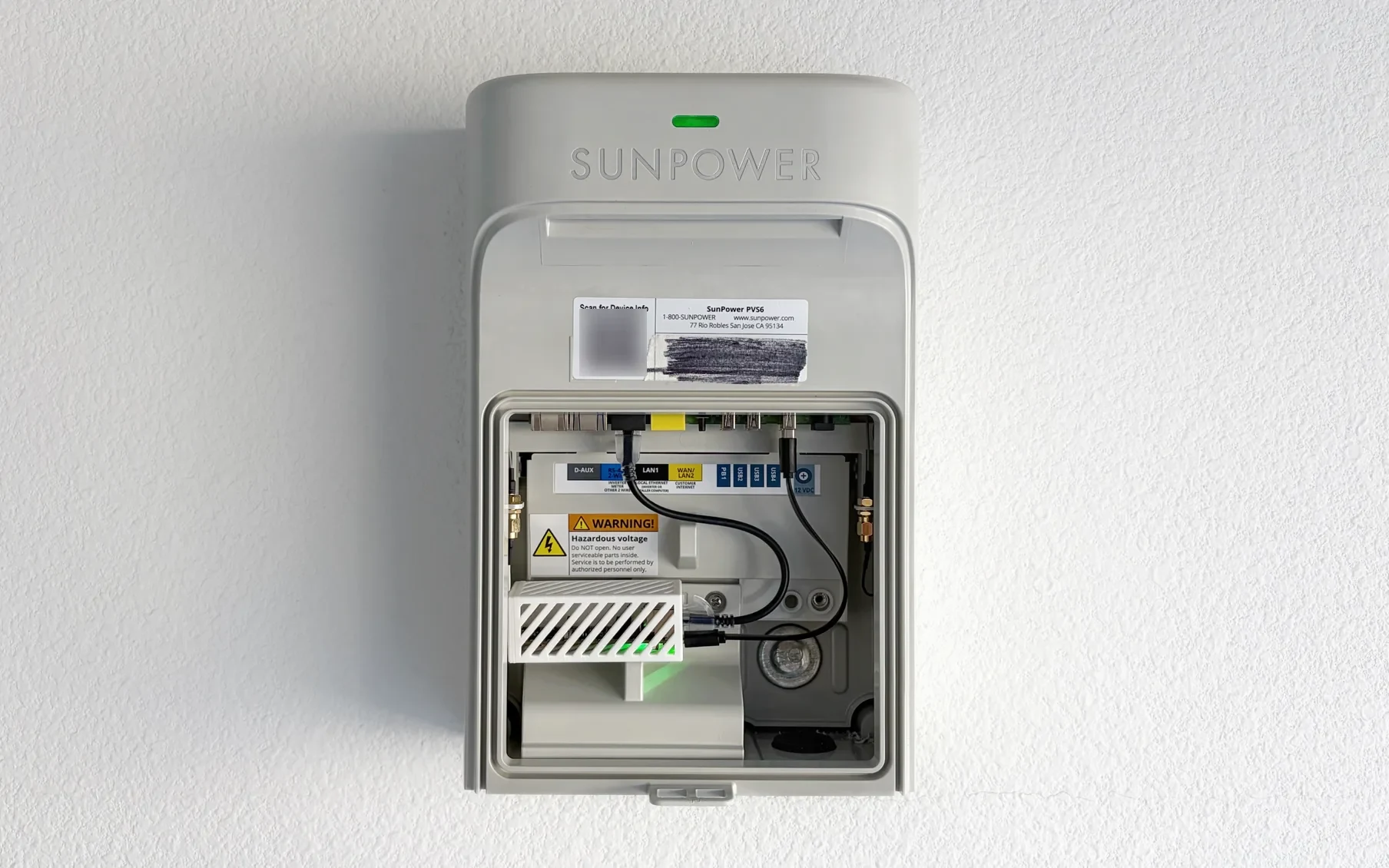 Solar Monitor installed inside a wall-mounted SunPower PVS6, connected to the LAN1 gateway port by Ethernet and powered over USB.